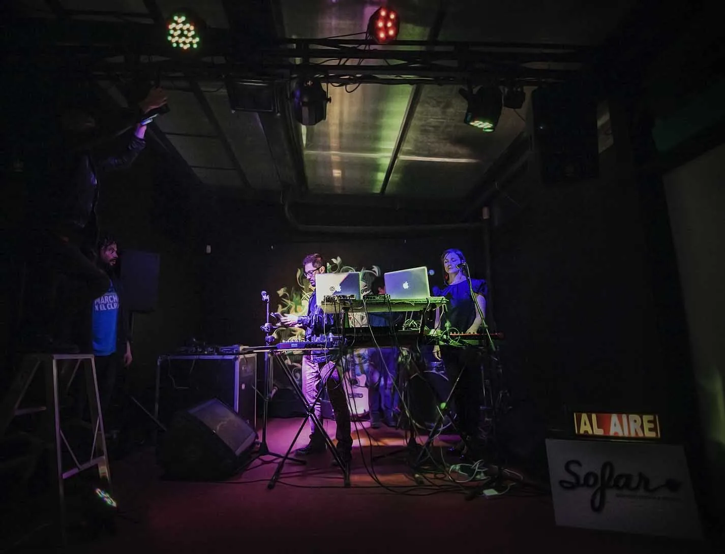 Live set on an intimate stage with the audience around