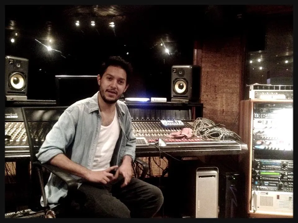 Horacio seated at a recording console